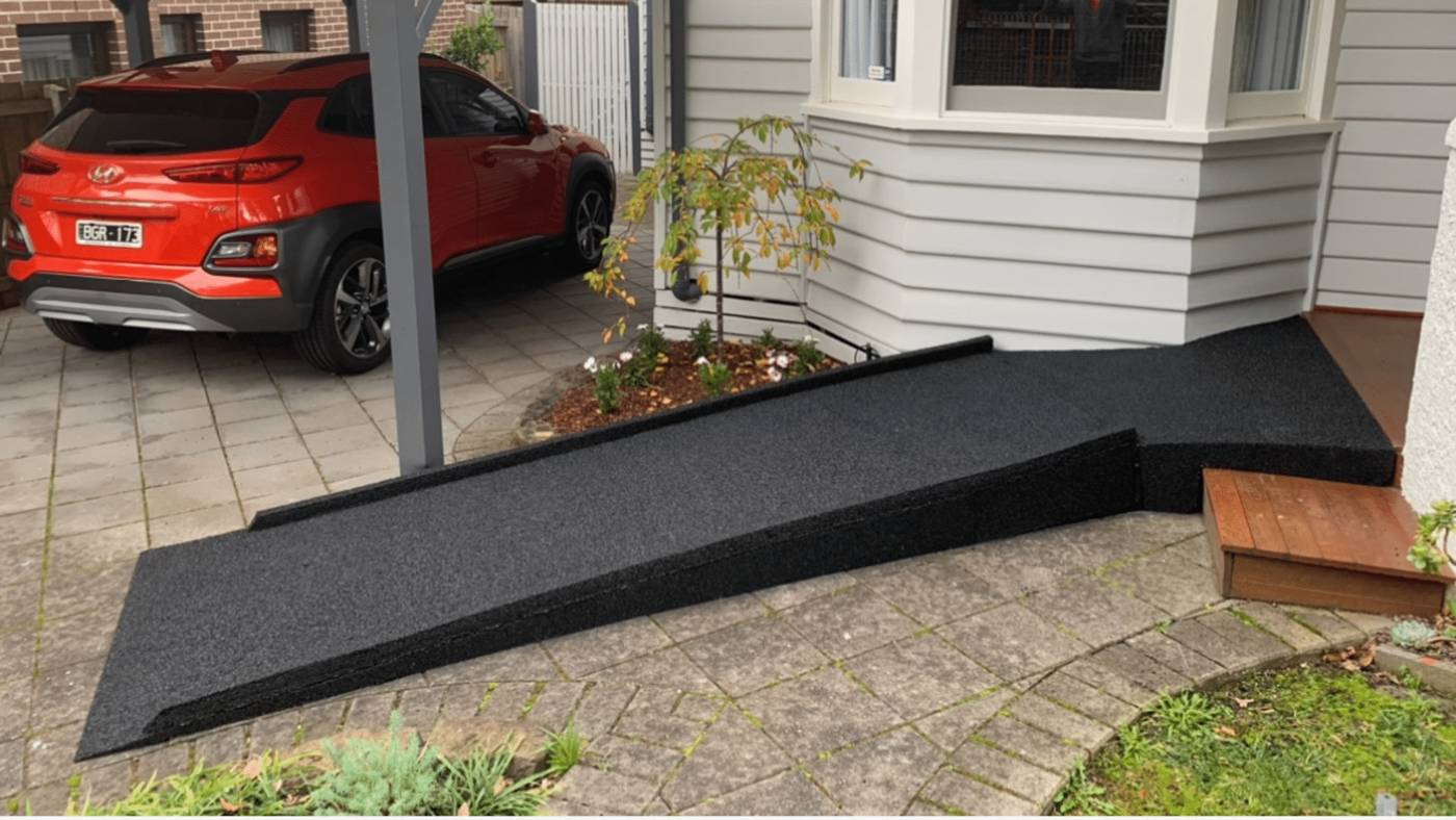 Custom rubber wheelchair ramp – front entry, Melbourne Custom recycled rubber wheelchair ramp leading to a Melbourne home front entry